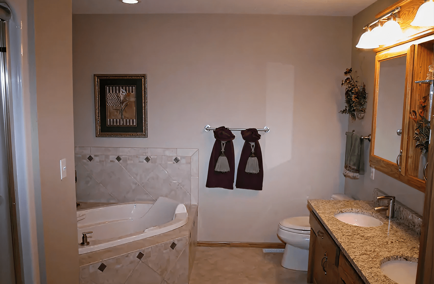 Elegant bathroom featuring decorative towels